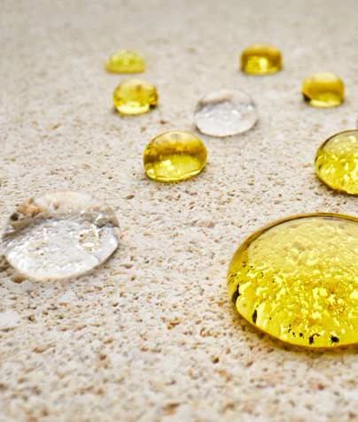 Sealed stone beading golden droplets